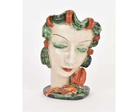 An Art Deco period Goldscheider pottery mask, model no.6305, modelled as a lady with green curled hair and eyeshadow contrast