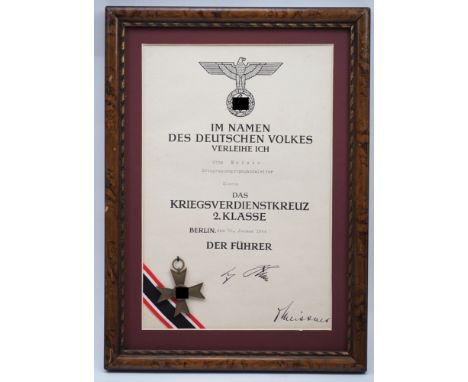 Kriegsverdienstkreuz, 2. Klasse mit Urkunde für den Ortsgruppenpropagandaleiter in Elsenz.Buntmetallstück, mit Band, die Urku