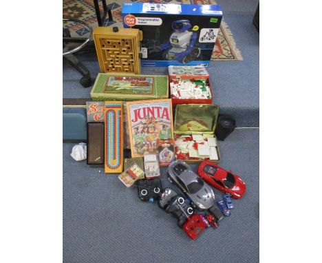 A mixed lot of toys and games to include a programmable robot, boxed, board games, diecast toy cars and othersLocation: FR 