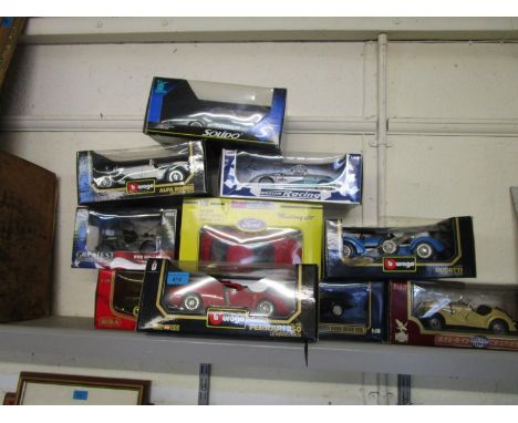 A group of Burago, Jouefevolution, Solido Auto World and other model diecast collectors vehicles in boxes to include a Ferrar