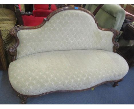 A Victorian walnut framed salon sofa having scroll supports and short cabriole feet, 32 1/2"h x 53 1/2"w 