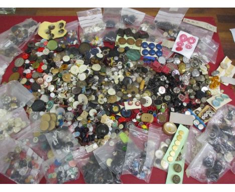 A large collection of vintage buttons to include early to mid 20th century plastic buttons, hand painted glass examples, moth