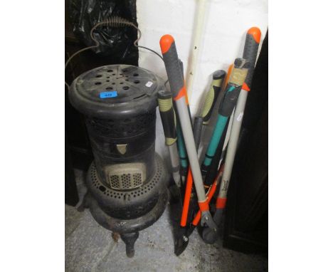 A mixed lot to include a Valor heater, mixed gardening tools and a workbench 