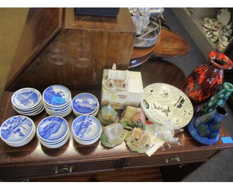 A quantity of Royal Copenhagen miniature pictorial plates in blues and white to include Christmas editions together with Lill