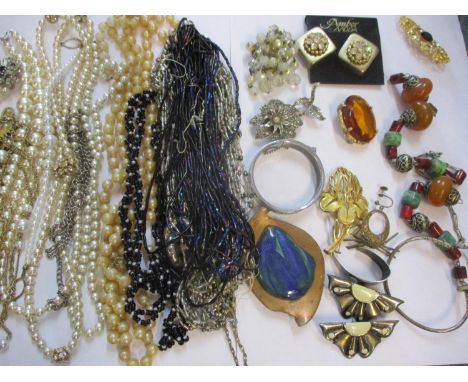 Costume jewellery to include an amber and bead necklace and an orange glass brooch A/F along with mixed wristwatches to inclu