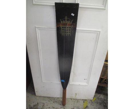 A vintage wooden rowing oar with House of Commons insignia 