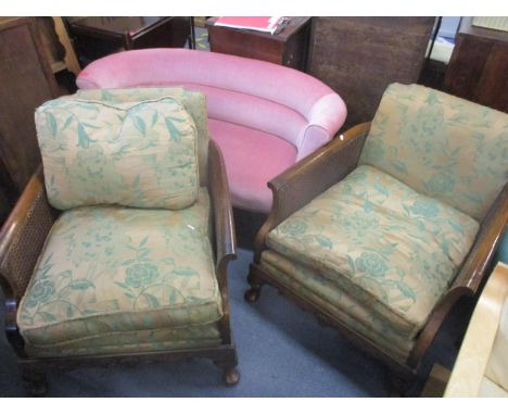 A pair of early 20th century Bergère armchairs, together with a two seater salon sofa and a two tier trolleyLocation: C 