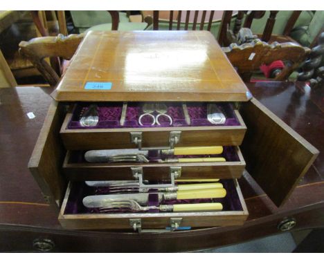 A Victorian walnut cased canteen of silver plated cutlery, three drawers containing a front set with berry spoons and grape s