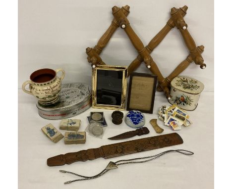 A box of assorted misc. items to include wooden items, stamps, coins and picture frames.  Box includes vintage wooden folding