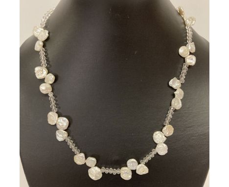 A keshi pearl and faceted glass bead necklace with 925 silver S shaped clasp.   Approx. 18".