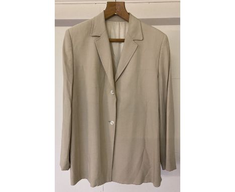 A fully lined summer weight beige single breast ladies jacket by Burberry.  Fully lined with Burberry logo and name to lining