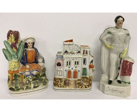 3 ceramic Staffordshire flatback figurines.  A house, a gentleman and a gentleman sitting in a garden. 