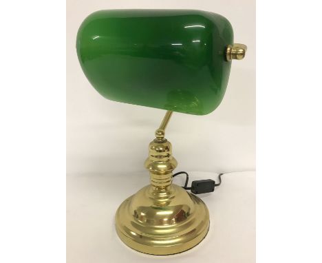 A modern brass desk lamp with green glass tilting shade.   Total height approx. 38cm.