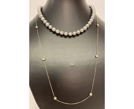 A vintage faux black pearl necklace with period stone set clasp.  Together with a vintage fine curb chain necklace set with 6