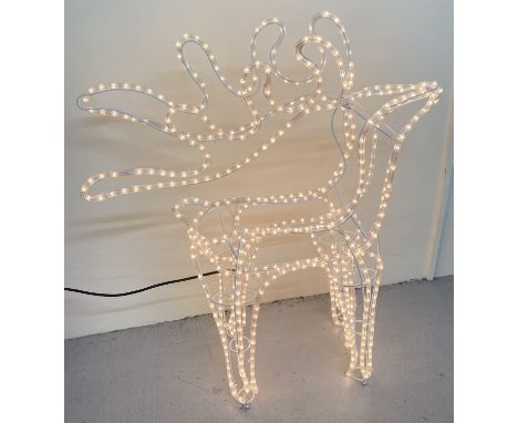 A 3D rope light outdoor Christmas decoration of a reindeer with original box.  Illuminated with white lights. With metal peg 