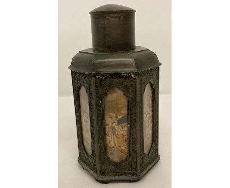 A Chinese pewter 7 sided tea caddy with reverse painted glass panelled sides.  Impressed mark to base.  Approx. 18cm tall.