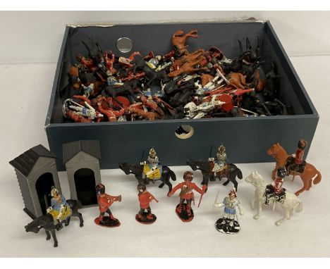 A quantity of assorted vintage plastic soldiers in red, black and white, some marked Charbens.  