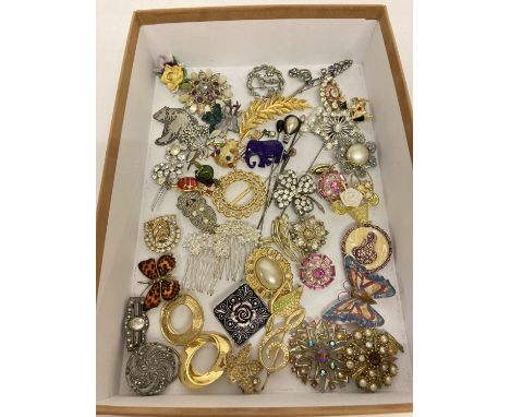 A collection of vintage and modern, brooches, scarf clips and hat pins.  To include stone set, animal, floral and insect desi