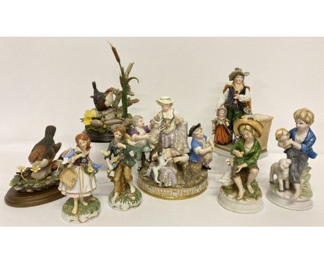 8 ceramic and resin figurines to include Country Artists, Dresden and Capodimonte.  