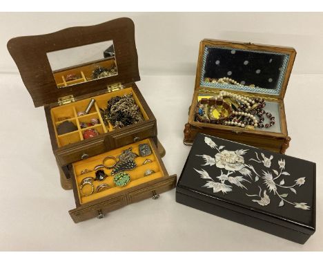 3 vintage jewellery boxes with contents.  2 wooden and one oriental black lacquer box with mother of pearl floral decoration.