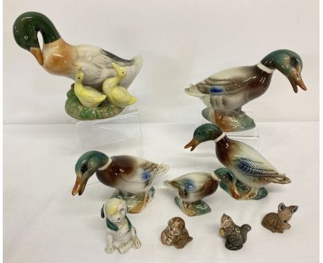 A small collection of ceramic ducks, mostly Mallards, together with Wade Whimsie animals.  