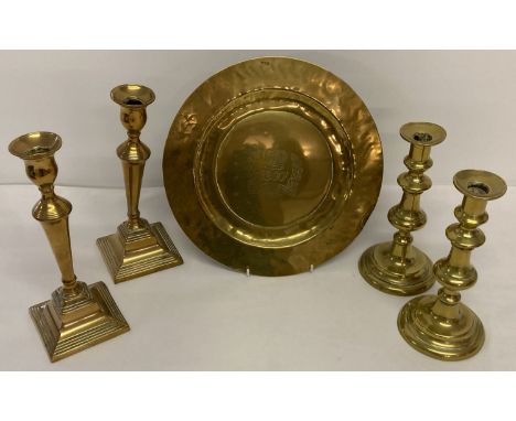 A collection of vintage brass ware items; 2 pairs of candlesticks together with a coronation plaque.  Both pairs of candlesti