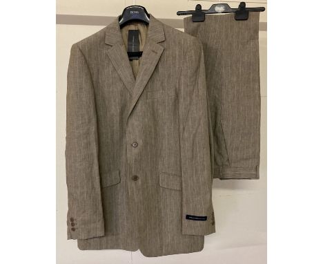 A brand new with tags men's dark beige pinstripe suit by French Connection.  Single breast jacket fully lined with both inter