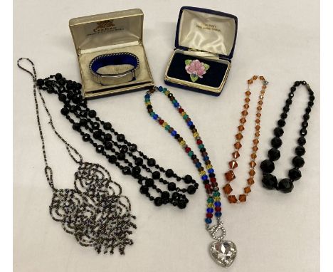 A collection of vintage and modern costume jewellery.  To include glass beaded necklaces and Coalport ceramic brooch. 