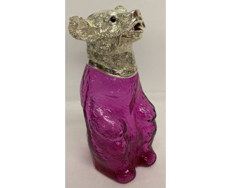 A pink/purple glass and silver plated novelty bear shaped decanter.  With hinged opening mouth lid and glass eyes.  Approx. 2