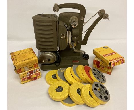 A vintage Noris 8 Junior film projector together with a collection of film reels.   Approx. 26cm tall.