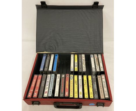 A red case containing a quantity of assorted vintage music audio cassettes.  To include: Dire Straights, Eric Clapton, Elmore