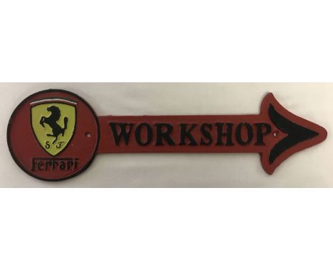 A painted cast metal Ferrari workshop arrow wall hanging sign.  Complete with fixing holes.  Approx. 42cm long.