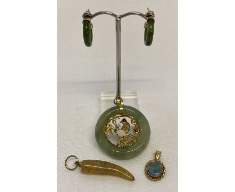 A circular jade pendant with central bird and bamboo detail, set with 2 small garnets and an opal.  Together with a pair of j