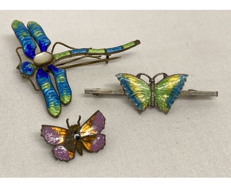 A vintage silver bar brooch set with green, yellow and blue enamelled butterfly.  Together with a vintage enamelled dragonfly