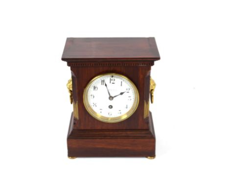 A mahogany cased mantel clock by Maple &amp; Co. Paris and London, circular white enamel dial flanked by lion mask handles, 2