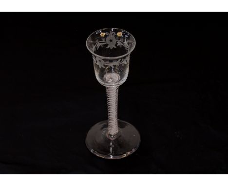 Two Georgian drinking glasses with spiral twist stems, another with foliate etched vine and bird decoration; another decorate