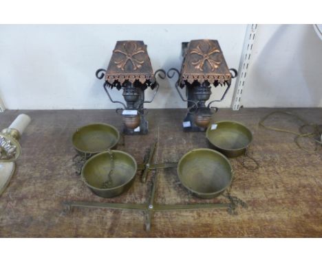 A pair of Gothic style steel wall lights and two sets of brass scales