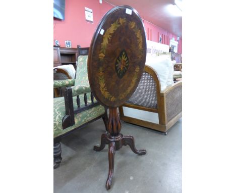 A Victorian style burr walnut and marquetry inlaid oval tilt top tripod table