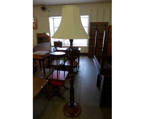 A mahogany standard lamp