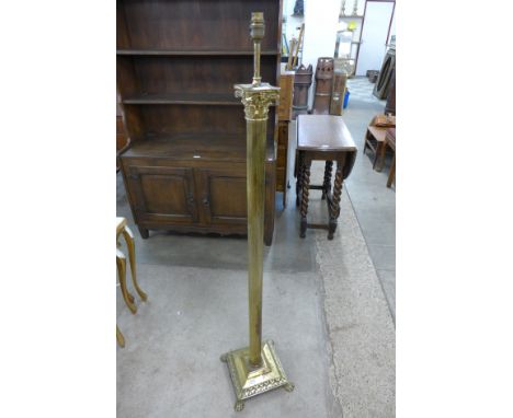 A brass Corinthian column standard lamp