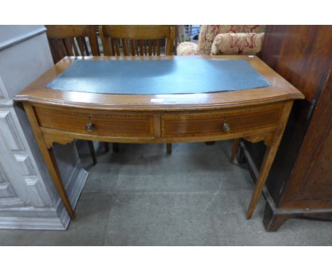 An Edward VII inlaid mahogany bow-fronted two drawer writing table