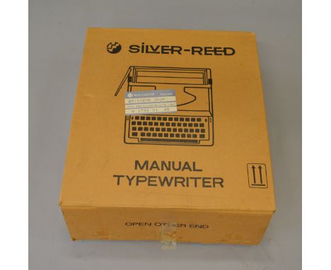 A Silver-Reed manual typewriter, boxed.