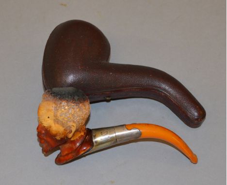 Meerschaum pipe in the form of a man's head with white metal collar stamped "Y & Co. 'Silver'"