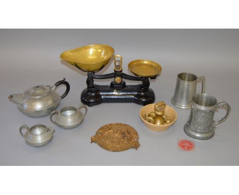 Set of cast iron balance scales with weights, metal safe plate and other petwer items.