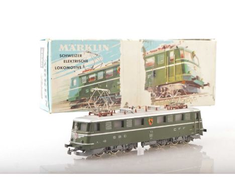 A boxed vintage Marklin HO Gauge 3-rail Swiss (SBB) overhead Electric Locomotive,  ref 3050, in SBB/CFF green livery as No. 1