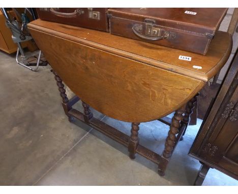 A barley twist gate leg table.