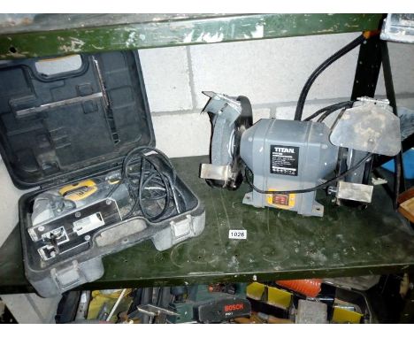 A JCB cased jigsaw and a titan bench grinder