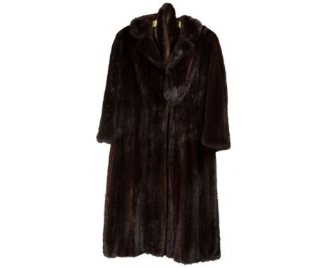 Mink Coat  Full length having a button and (3) hook closures, loop-less belted waist option, side slash pockets, custom zippe