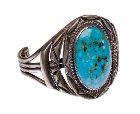 Orville Tsinnie Sterling Silver and Turquoise Cuff Bracelet  Navajo-made cuff bracelet having pierced silver motif with oval 