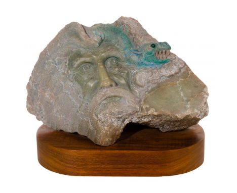 Carved Rock Statue  Natural stone sculpture having bearded male face beneath a dragon, atop a wood plinth  Property from: a C